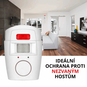 Bílý domácí bezdrátový alarm s červeným světlem umístěný v moderním interiéru obytné místnosti, určený pro ochranu proti nechtěným hostům.