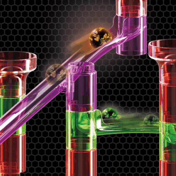 Počítačová grafika znázorňující barevné skleněné trubice a kuličky v zelené, růžové a červené barvě na černém hexagonálním pozadí, připomínající abstraktní laboratorní nebo herní prostředí.