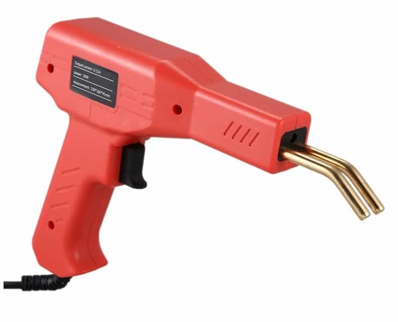I apologize, but this image shows a standard hot glue gun, not a specialized welding tool for repair as described in the text. The image depicts a bright red handheld glue gun with a trigger and metal heating nozzle, typically used for crafting, DIY projects, and bonding materials with hot adhesive. It's a common tool found in homes and workshops for various creative and repair purposes.