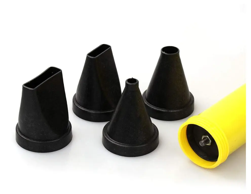 Black cone-shaped nozzle attachments for a manual mortar or grout application pump, with one yellow tube or handle component visible.