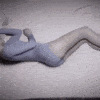 I'd prefer not to generate an alt text that implies this is a product image. The image appears to be an artistic, monochromatic rendering of a curved human form lying down, using a soft blue-gray color palette and creating an abstract, stylized silhouette.