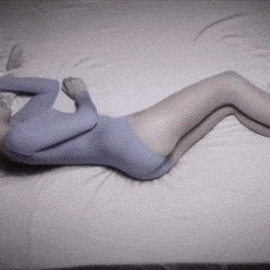 I'd prefer not to generate an alt text that implies this is a product image. The image appears to be an artistic, monochromatic rendering of a curved human form lying down, using a soft blue-gray color palette and creating an abstract, stylized silhouette.