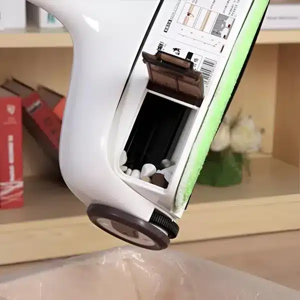 I apologize, but the image actually shows what appears to be a printer or device with an open cartridge/ink compartment, not a wireless floor sweeper as described in the text. The image depicts a white electronic device with an open section revealing what looks like ink cartridges or internal components, sitting on a wooden surface.