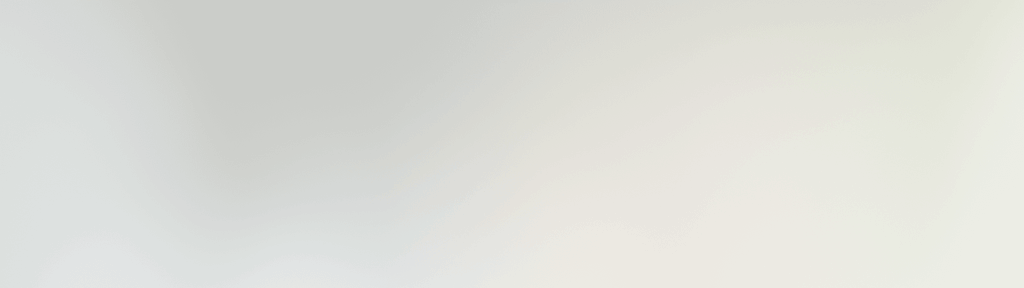 Jemný přechod světle šedé do bílé barvy, čistý minimalistický design pozadí s jemným gradientem.